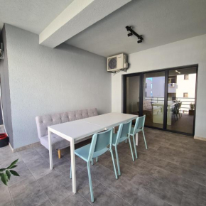 Beach apartment with big terrace and private parking